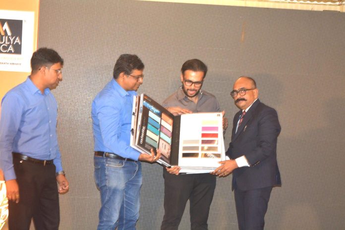 Amulya Mica leaders on stage unveiling new products and quarterly magazine at the 2025 Varanasi Sales Conclave